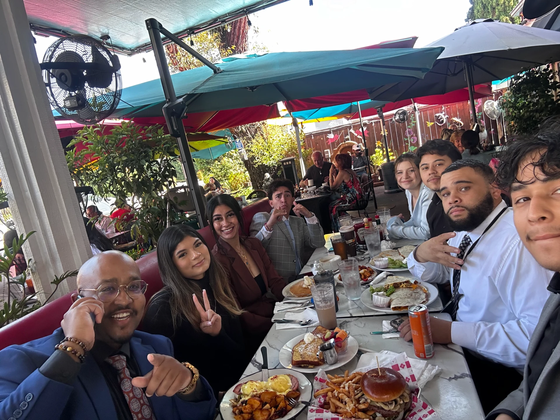 Team gathering at restaurant for Magnolia Alliance Royal